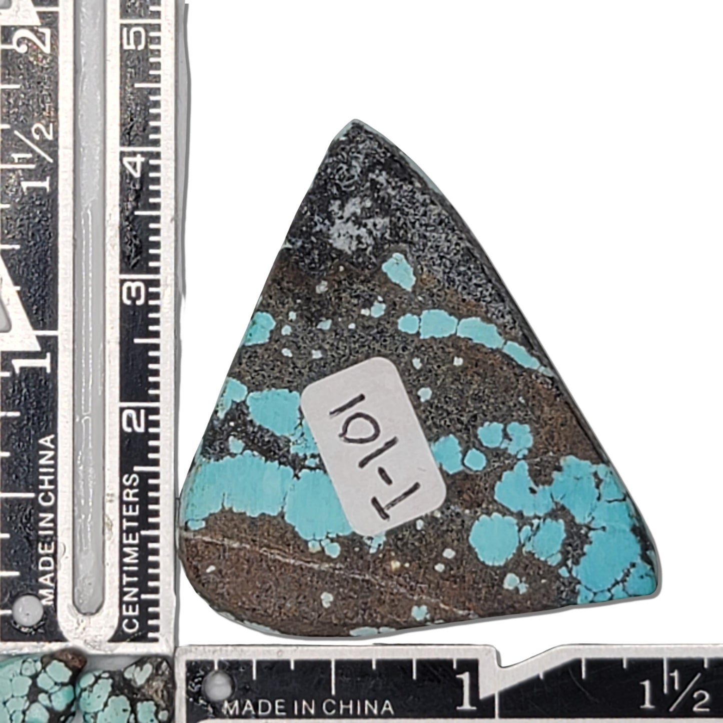 A 13-gram natural turquoise rough stone with a triangular shape, vibrant sky-blue color, and black webbing matrix. Ideal for jewelry design or lapidary projects, available at www.naturalturquoise.com.