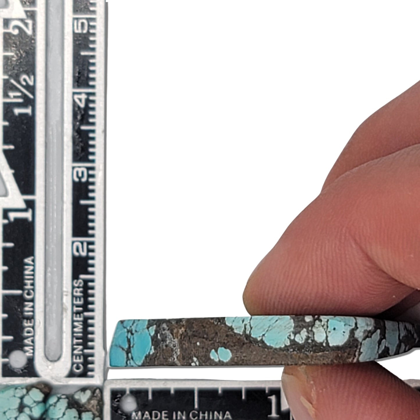 A 13-gram natural turquoise rough stone with a triangular shape, vibrant sky-blue color, and black webbing matrix. Ideal for jewelry design or lapidary projects, available at www.naturalturquoise.com.