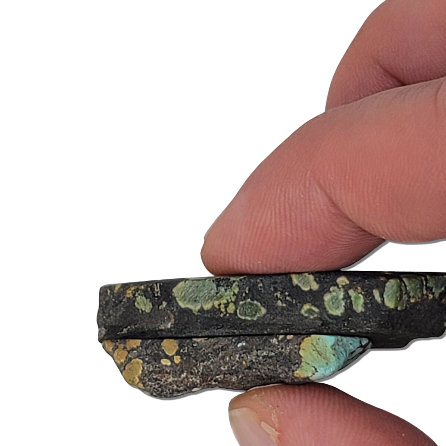 An 18-gram pair of natural turquoise stones featuring deep green and golden hues with hints of blue. Ideal for custom jewelry or lapidary use, available at www.naturalturquoise.com.