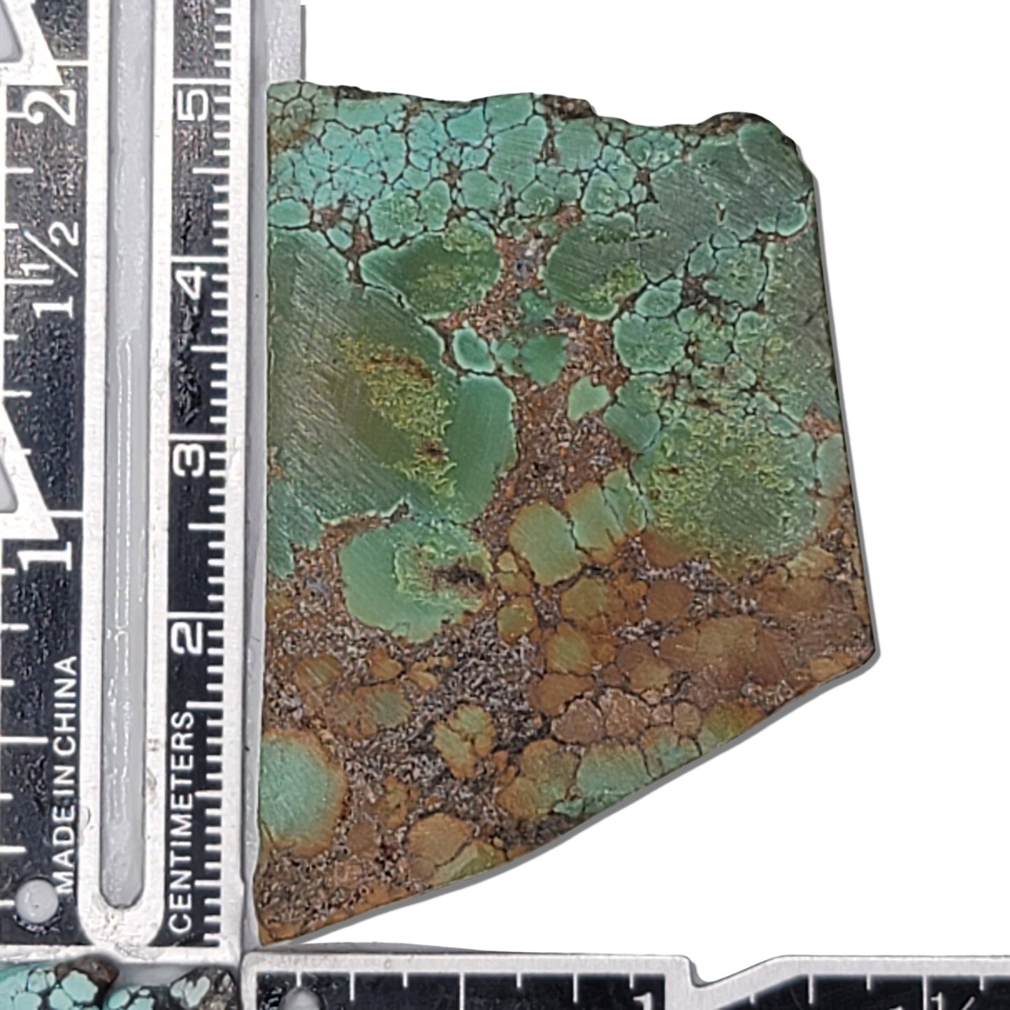A natural turquoise stone weighing 22 grams, featuring vibrant green hues with a golden-brown matrix, perfect for jewelry or lapidary work. Available at www.naturalturquoise.com.