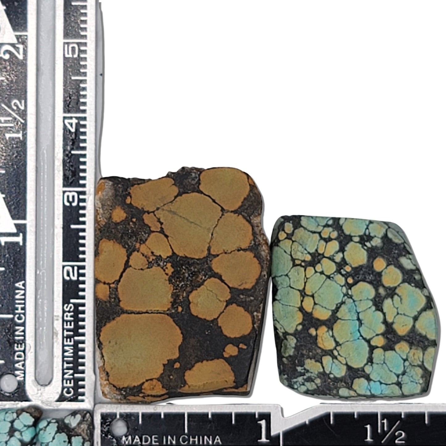 A pair of natural turquoise stones weighing 21 grams, featuring earthy golden tones and vibrant blue-green accents with bold dark matrix patterns. The stones measure approximately 3.8 cm x 3.2 cm and 3.5 cm x 2.8 cm, displayed with a ruler for scale. Available for purchase at www.naturalturquoise.com, ideal for lapidary and jewelry projects.