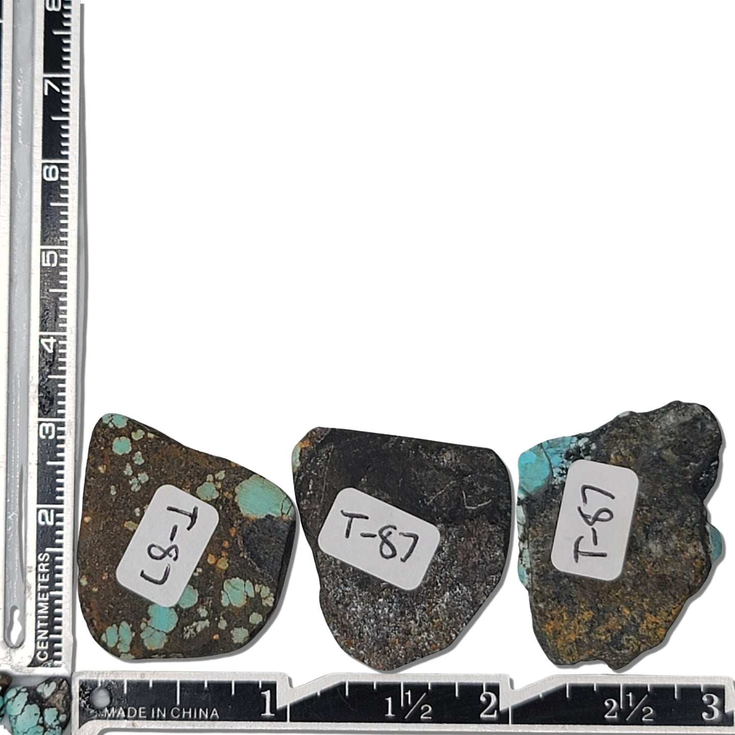 A natural turquoise stone triplet weighing 21 grams, featuring vibrant blue tones with golden accents and bold dark matrix patterns. The stones measure approximately 4 cm x 3 cm, 3.8 cm x 2.8 cm, and 3.7 cm x 2.5 cm, displayed with a ruler for scale. Available for purchase at www.naturalturquoise.com, ideal for lapidary and jewelry projects.