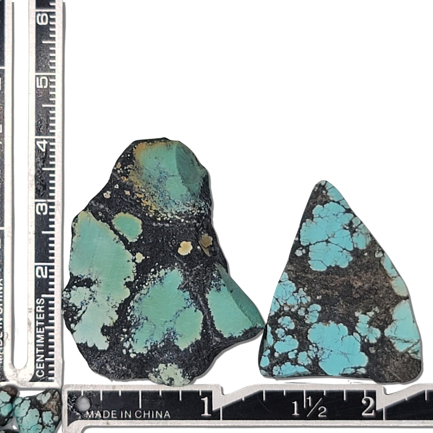 A natural turquoise stone pair weighing 22 grams, featuring rich green and vibrant blue hues with bold dark matrix patterns. The stones measure approximately 4.5 cm x 3.2 cm and 4 cm x 2.8 cm, displayed with a ruler for scale. Available for purchase at www.naturalturquoise.com, perfect for lapidary and jewelry projects.