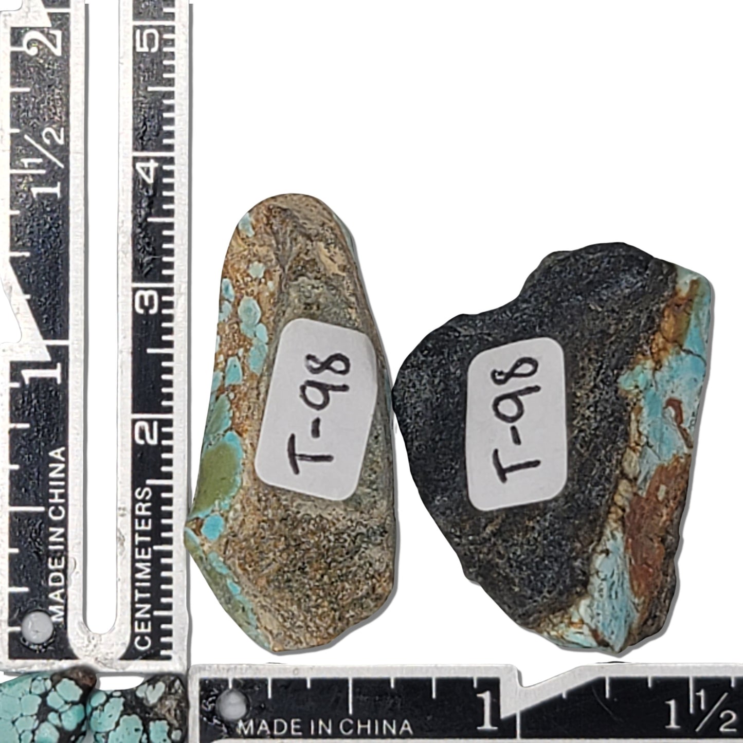 A pair of 17-gram natural turquoise rough stones featuring sky blue hues with brown and gold matrix patterns. The largest stone measures approximately 4.0 cm x 2.0 cm x 0.6 cm. Ideal for jewelry design or lapidary projects, available at www.naturalturquoise.com.